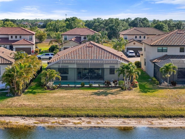14309 Carolina Sky Pl, Lakewood Ranch, FL 34211 - rear view of property with glass enclosure, a water view, a yard, and an outdoor pool