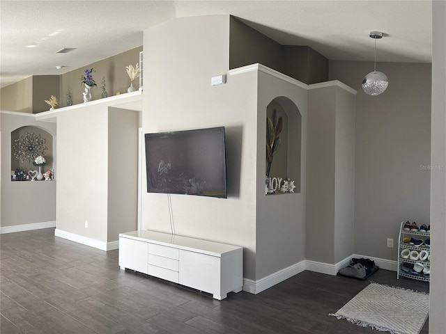 living room featuring baseboards, dark wood-type flooring, and visible vents