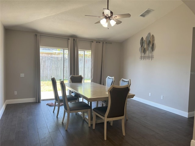 dining space featuring visible vents, baseboards, ceiling fan, and dark wood-style floors
