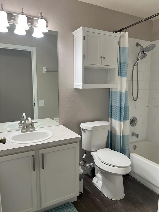 bathroom featuring shower / tub combo with curtain, toilet, vanity, and wood finished floors