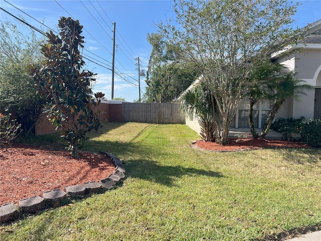 view of yard with fence