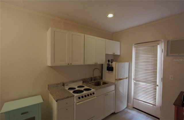 525 Rawls Ave, Sarasota, FL 34236 - kitchen with white appliances, white cabinetry, crown molding, and a sink