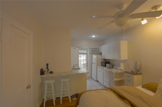 525 Rawls Ave, Sarasota, FL 34236 - bedroom featuring freestanding refrigerator, a sink, and ceiling fan