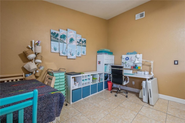 tiled office space with baseboards and visible vents