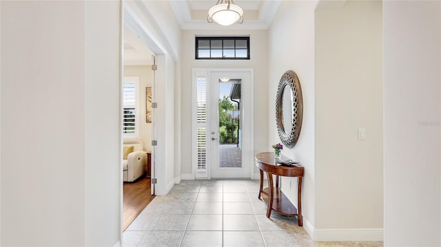 1358 Cielo Ct, North Venice, FL 34275 - entryway with crown molding, baseboards, light tile patterned flooring, and a high ceiling