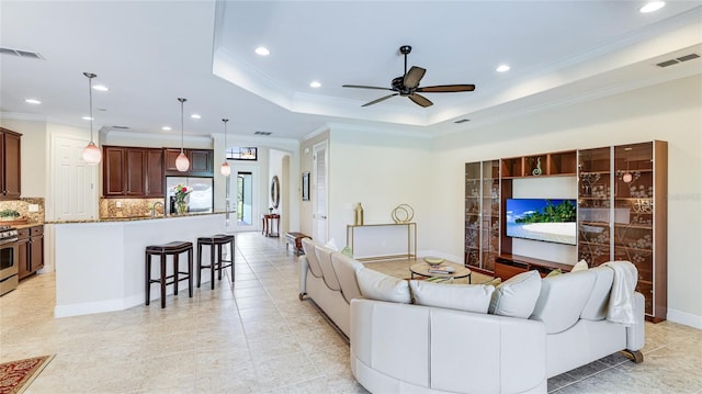 1358 Cielo Ct, North Venice, FL 34275 - living area featuring ceiling fan, crown molding, visible vents, and recessed lighting