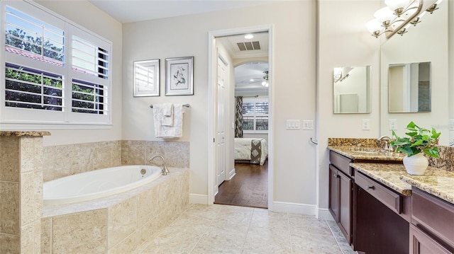 1358 Cielo Ct, North Venice, FL 34275 - bathroom with a garden tub, connected bathroom, visible vents, tile patterned flooring, and vanity