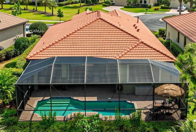 1358 Cielo Ct, North Venice, FL 34275 - rear view of house with a tiled roof, a patio, a lanai, and an outdoor pool