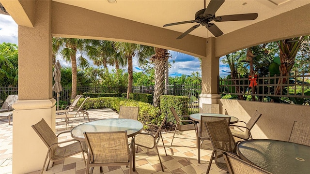 1358 Cielo Ct, North Venice, FL 34275 - view of patio / terrace featuring a fenced backyard, outdoor dining space, and a ceiling fan