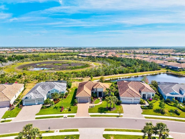 bird's eye view featuring a residential view and a water view