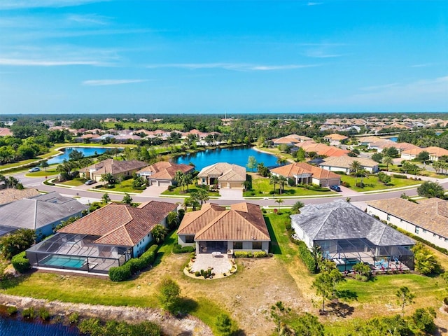 bird's eye view with a water view and a residential view
