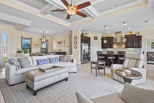 living area featuring crown molding, coffered ceiling, and a ceiling fan