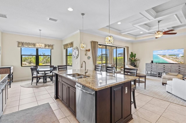 kitchen featuring plenty of natural light, stainless steel dishwasher, crown molding, and a sink