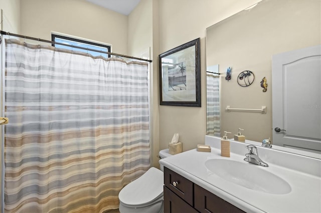 full bathroom featuring toilet, vanity, and a shower with shower curtain