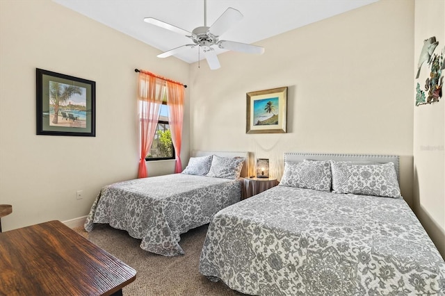 carpeted bedroom with baseboards and a ceiling fan