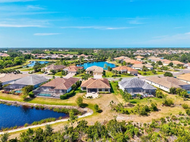 bird's eye view featuring a residential view and a water view