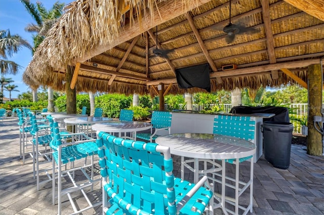view of patio / terrace featuring a gazebo and a bar