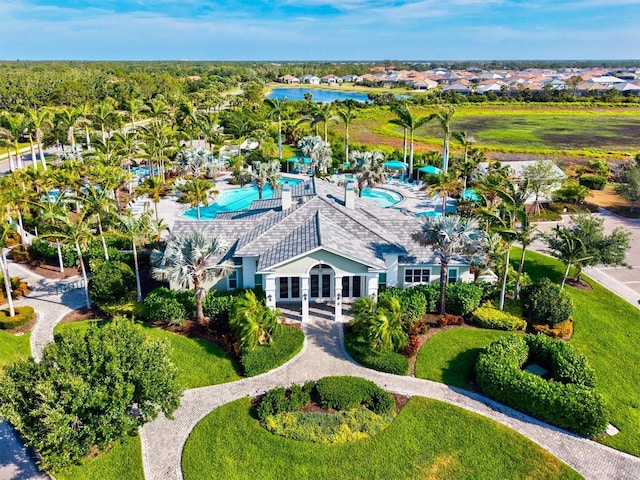 birds eye view of property featuring a residential view and a water view