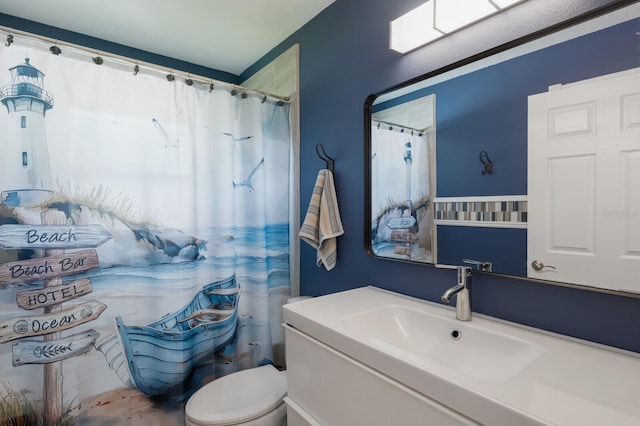 full bathroom with vanity, toilet, and a shower with shower curtain