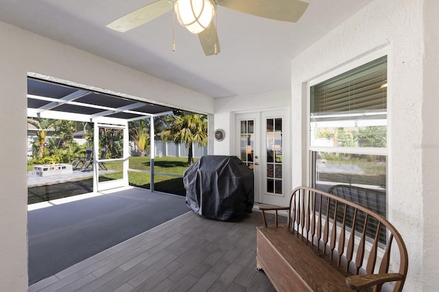 sunroom with ceiling fan and french doors