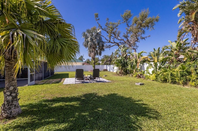 view of yard with fence and a patio area