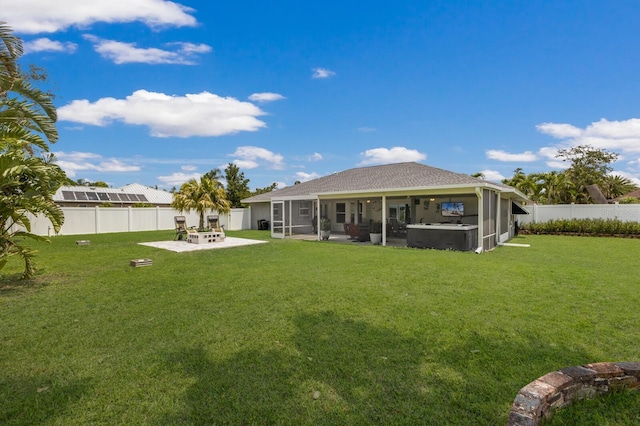 3889 Canopy Way, Sarasota, FL 34235 - rear view of house featuring a sunroom, a patio, a fire pit, and a shingled roof