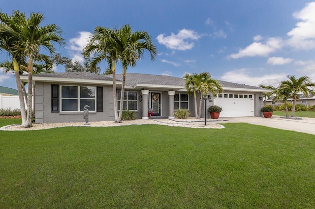3889 Canopy Way, Sarasota, FL 34235 - ranch-style home with driveway, a front yard, an attached garage, and stucco siding