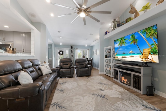 3889 Canopy Way, Sarasota, FL 34235 - living area featuring light wood-type flooring, baseboards, ceiling fan, vaulted ceiling, and recessed lighting
