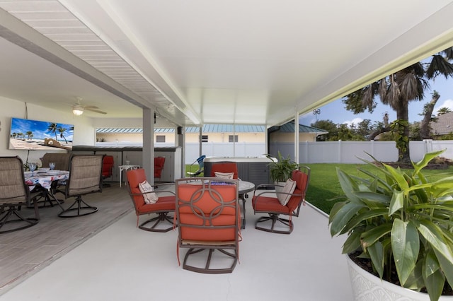 3889 Canopy Way, Sarasota, FL 34235 - view of patio / terrace with a hot tub, outdoor dining area, and a fenced backyard