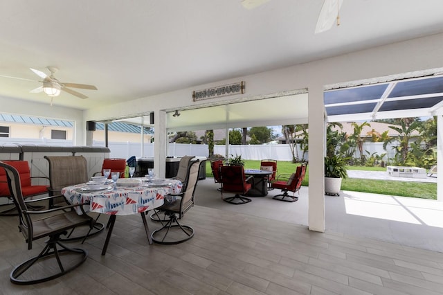 3889 Canopy Way, Sarasota, FL 34235 - view of patio / terrace with outdoor dining space, ceiling fan, fence, and a hot tub