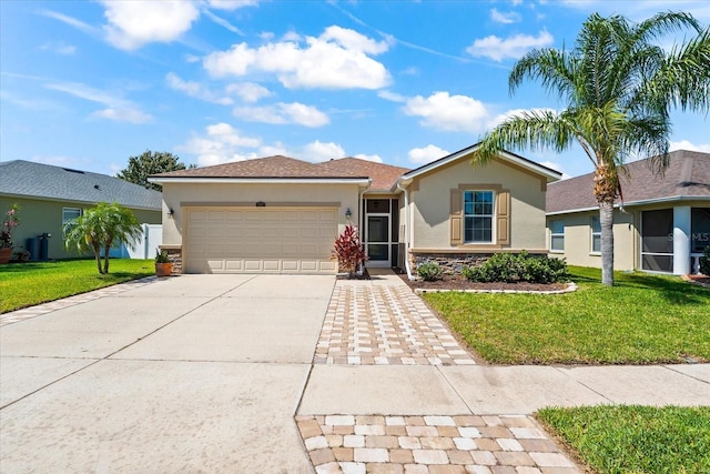 view of front facade with a front lawn, stucco siding, concrete driveway, and an attached garage
