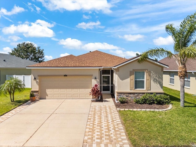 single story home with stucco siding, driveway, stone siding, and a garage