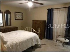 25 Philox Ln, Palm Coast, FL 32164 - bedroom featuring light colored carpet and ceiling fan