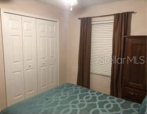 25 Philox Ln, Palm Coast, FL 32164 - bedroom featuring a closet and ceiling fan
