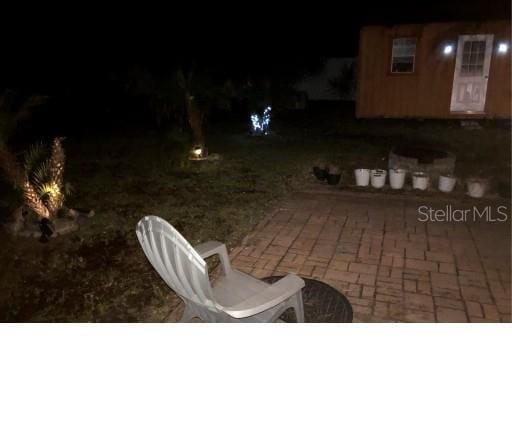 25 Philox Ln, Palm Coast, FL 32164 - view of patio at twilight