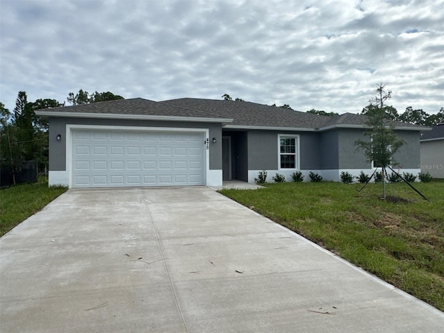 475 Tobias St SE, Palm Bay, FL 32909 - ranch-style home with stucco siding, driveway, a front yard, and a garage