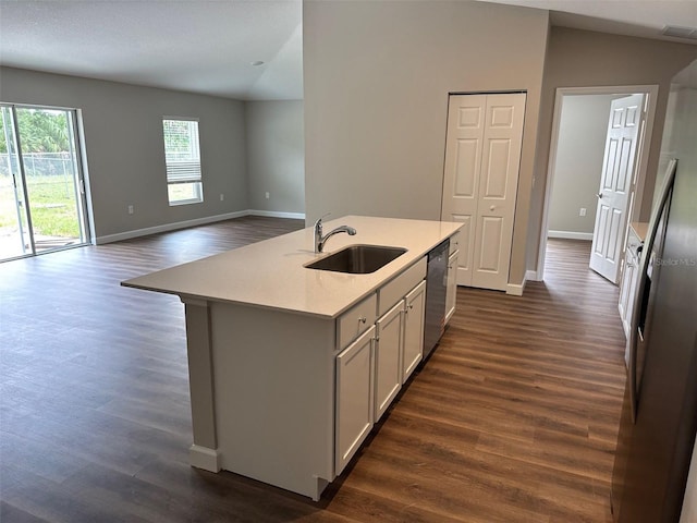 475 Tobias St SE, Palm Bay, FL 32909 - kitchen with a sink, appliances with stainless steel finishes, light countertops, dark wood-style flooring, and open floor plan