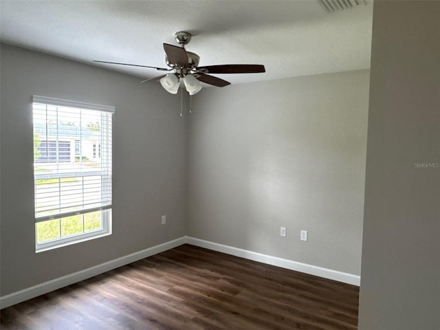 475 Tobias St SE, Palm Bay, FL 32909 - unfurnished room with dark wood finished floors, baseboards, and ceiling fan