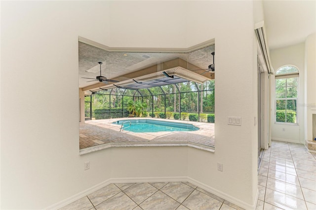 pool featuring ceiling fan, a lanai, and a patio area