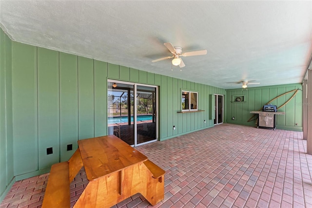 view of patio featuring ceiling fan