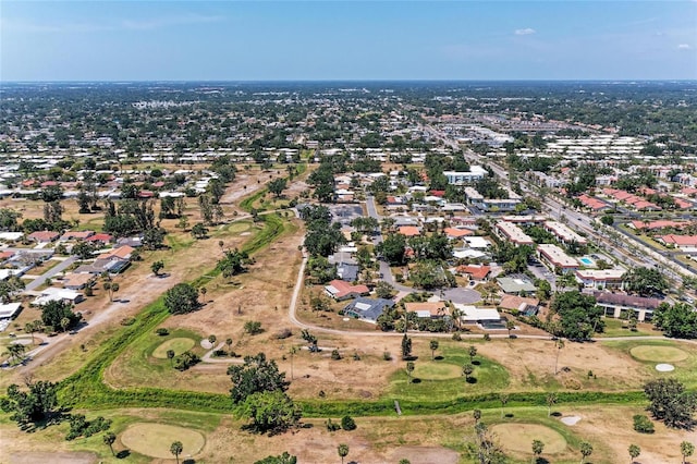 birds eye view of property featuring a residential view and view of golf course