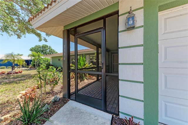 doorway to property with stucco siding