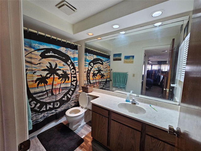 bathroom featuring recessed lighting, wood finished floors, visible vents, toilet, and vanity