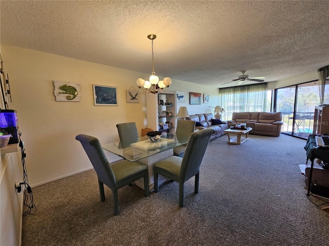 carpeted dining room featuring a textured ceiling and ceiling fan with notable chandelier
