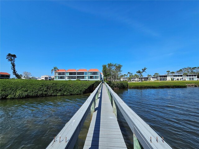 dock area with a water view