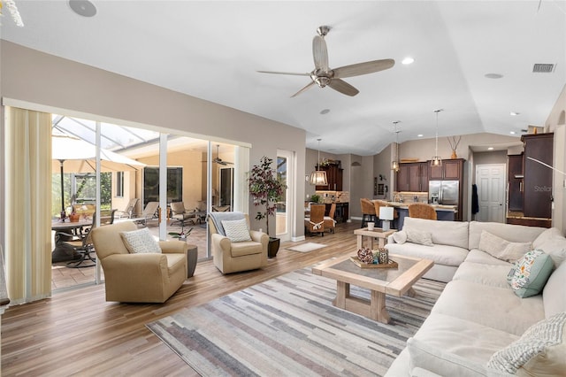 6231 Cypress Bend Ct, University Park, FL 34201 - living area featuring lofted ceiling, light wood finished floors, ceiling fan, and recessed lighting