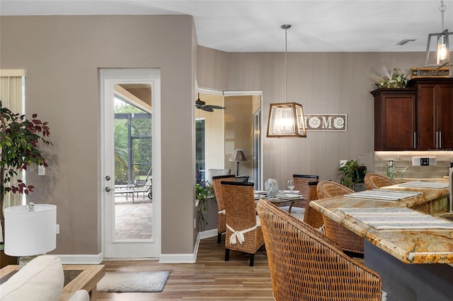 6231 Cypress Bend Ct, University Park, FL 34201 - dining area featuring light wood-style floors, baseboards, and ceiling fan
