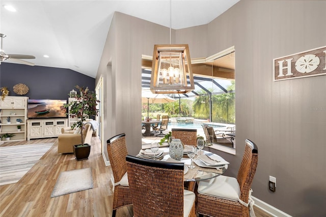 6231 Cypress Bend Ct, University Park, FL 34201 - dining space featuring a ceiling fan, wood finished floors, lofted ceiling, a sunroom, and recessed lighting