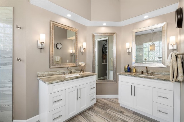 6231 Cypress Bend Ct, University Park, FL 34201 - bathroom with two vanities, baseboards, and recessed lighting