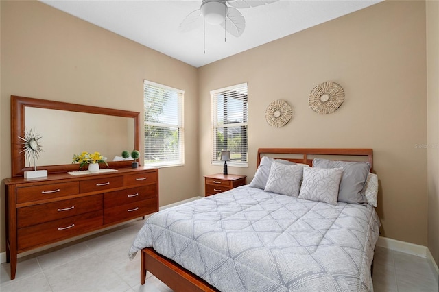 6231 Cypress Bend Ct, University Park, FL 34201 - bedroom with light tile patterned flooring, baseboards, and a ceiling fan